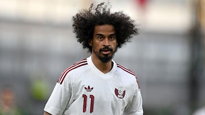 Akram Afif in a white Qatar kit