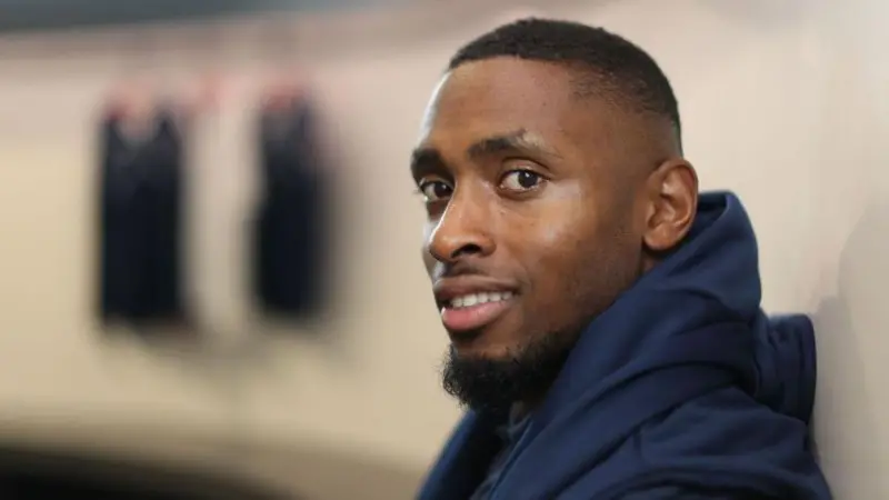 Joel Fearon smiles while wearing his training kit