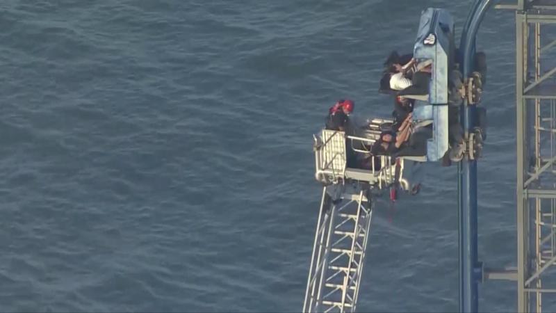 Watch rescue after rollercoaster stalls 100ft in the air