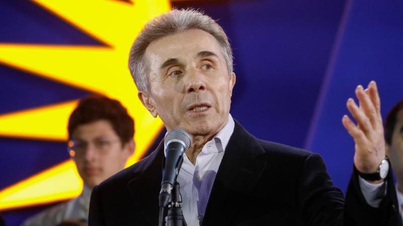 The founder of Georgia's ruling party Bidzina Ivanishvili looks at a crowd and gesticulates during a speech