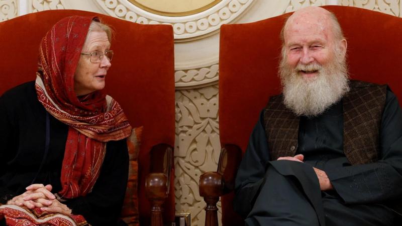 Son of British couple held by Taliban 'ecstatic' as they return to UK