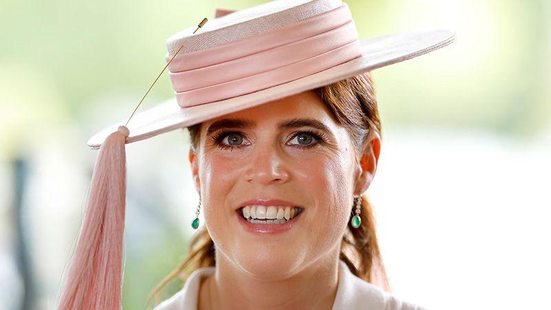 Princess Eugenie wearing a pink hat with white rim