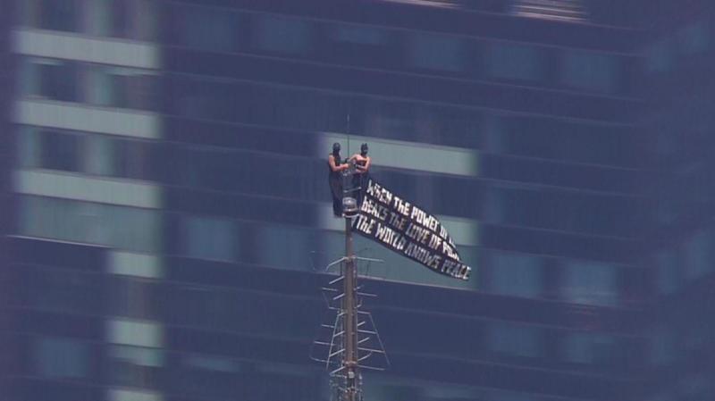 Two people climb to top of NYC's Empire State Building