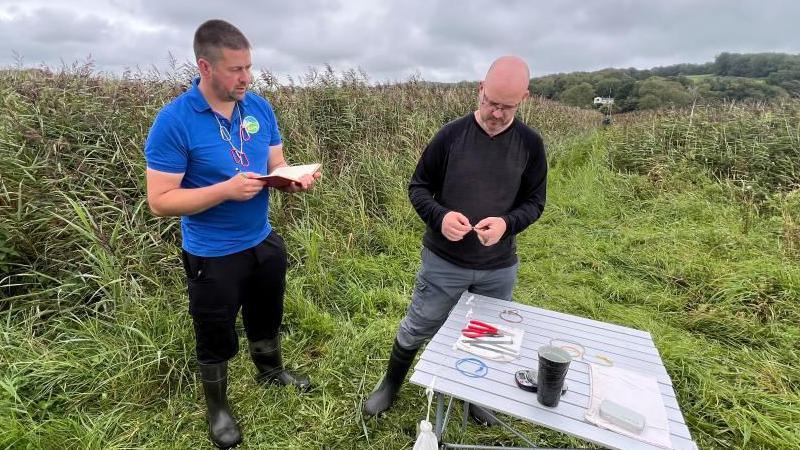 Nick Godden, assistant warden at Leighton Moss RSPB (left) and Stuart Sharp, senior lecturer at Lancaster University. The pair are standing by a table with ringing equipment at the nature reserve.