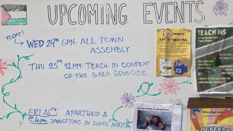 The Gaza protest camp noticeboard sets out a timetable of events