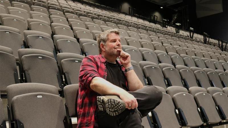 An image of Ian Skye sat on a seat in Becketwell Arena in Derby