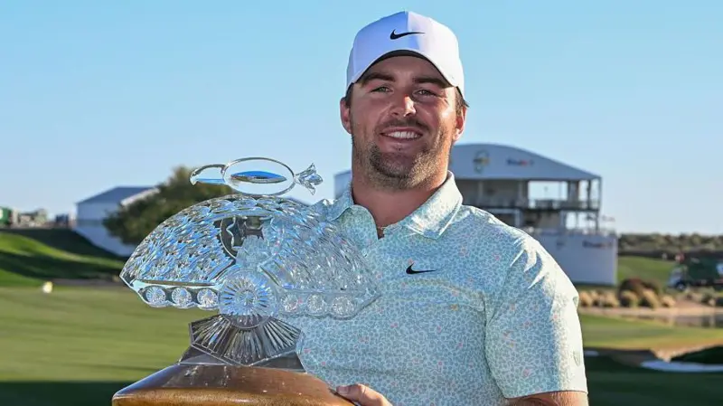 Chris Gotterup holds the Phoenix Open trophy