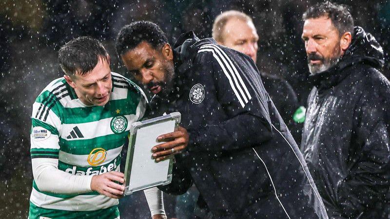 Wilfried Nancy and his tactics board with Callum McGregor
