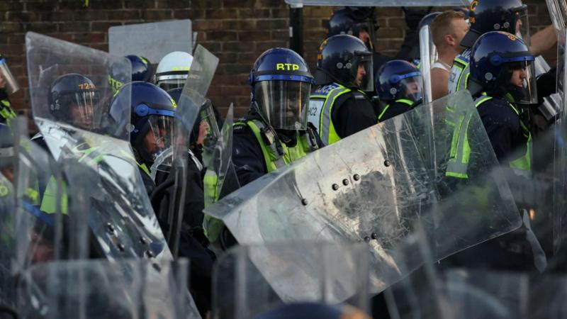 Watch: Protesters and riot police clash near home of Nowak's killer