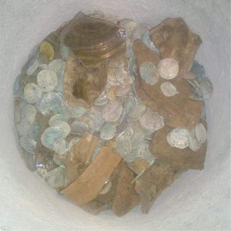 Pottery bowl with coins