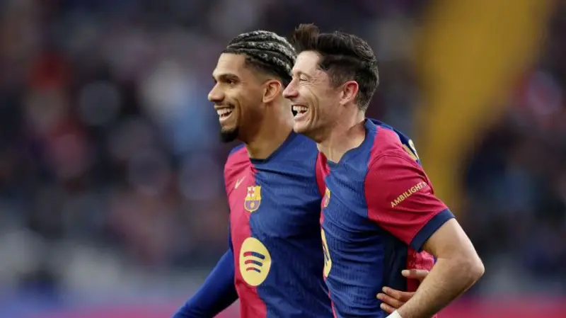 Barcelona thrash 10-man Real Sociedad to go top of La Liga