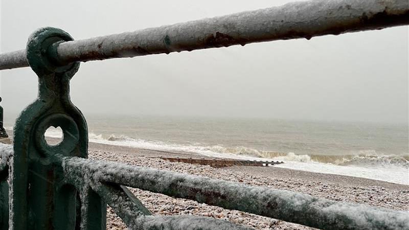 Snow settles on railings at Hove Beach