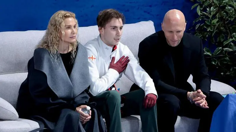 Georgia's Nika Egadze and coach Eteri Tutberidze sitting on a sofa