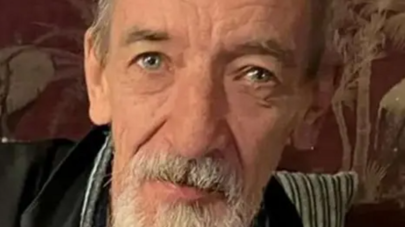 A man with a grey beard.