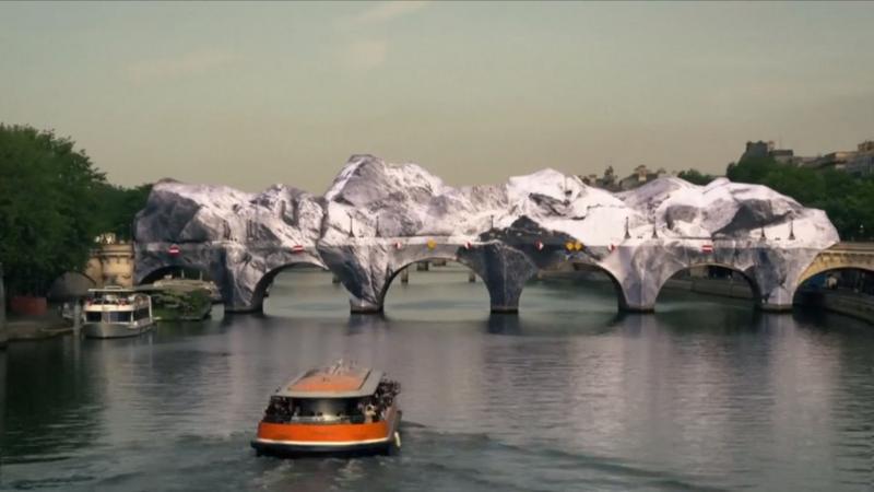 Timelapse footage shows 'giant cave' inflating on Paris bridge