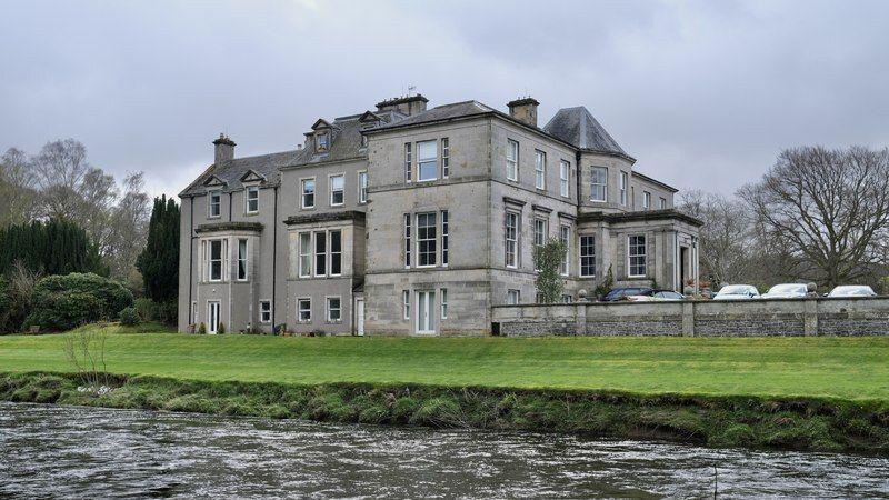 Kingsmeadows House, a stately-looking home, sitting on the banks of the river Tweed, surrounded by woodland