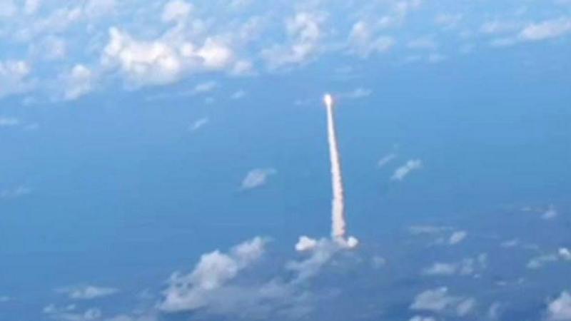 Passengers watch Artemis II blast off from commercial plane