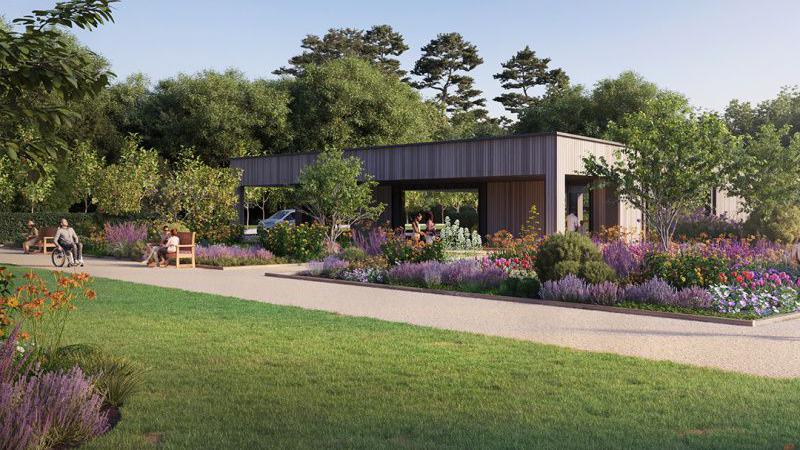 An artists impression of what a garden will look like at Pinewood Studios, including plants, trees, grass, a building and people sitting down on benches.