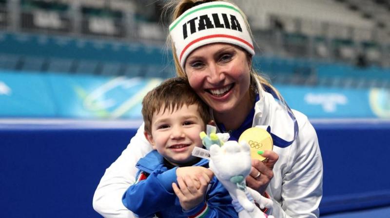 Speed skater's son joins celebrations for Italy's first gold