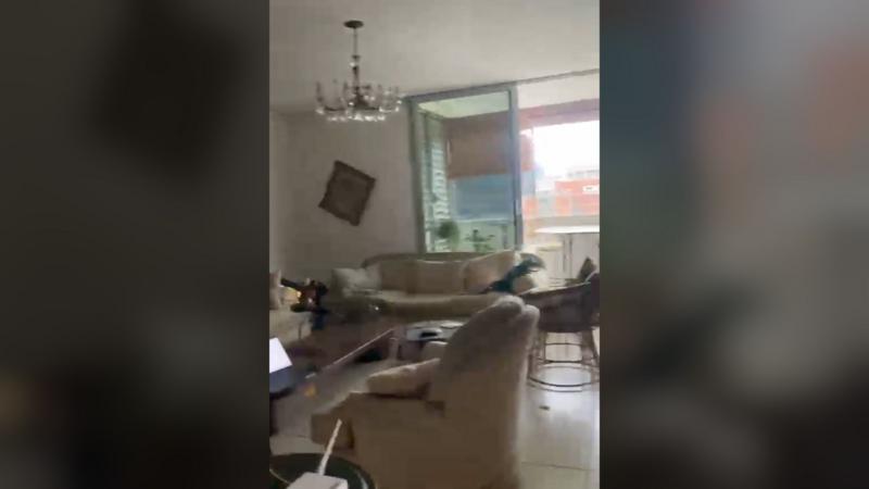 Moment BBC reporter's apartment shakes