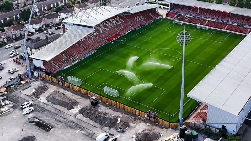 Mystery at Wrexham: San Siro Pitch and Missing Kop Explained!