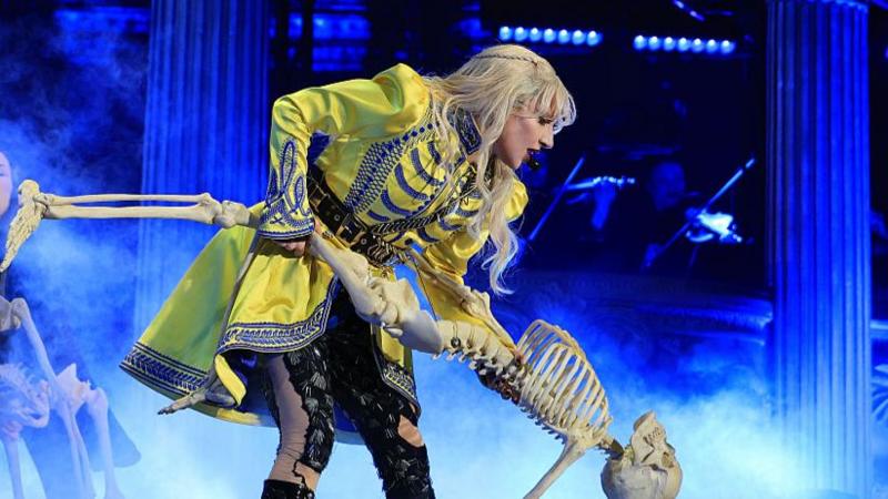 Lady Gaga on stage in Brazil dancing with a skeleton