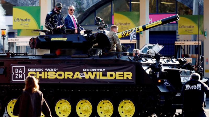 Chisora arrives to Wilder event in tank with Farage