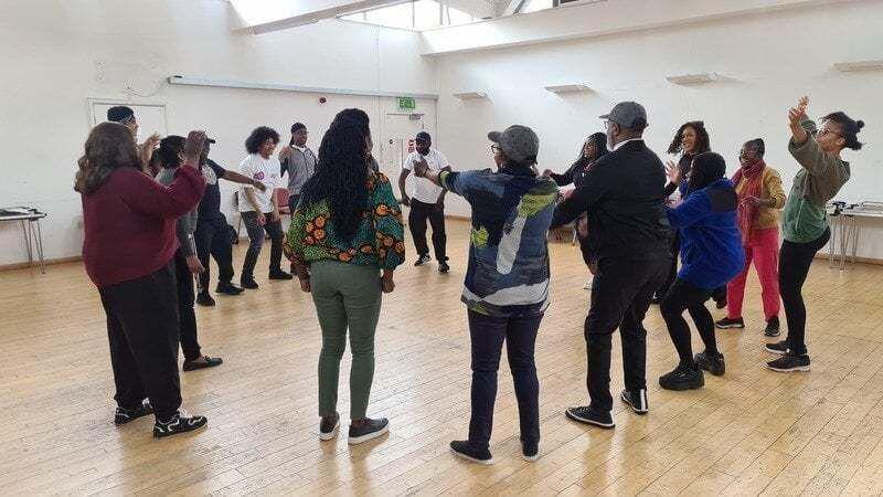Image showing members of the BAP Theatre group in a circle
