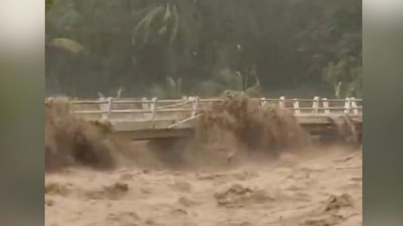 Moment Indonesian river overflows from heavy rain