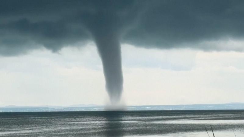 Moment huge waterspout twirls over lake in Germany
