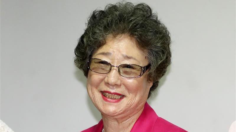 Choi Mal-ja in a pink coat, in a picture taken just before the verdict