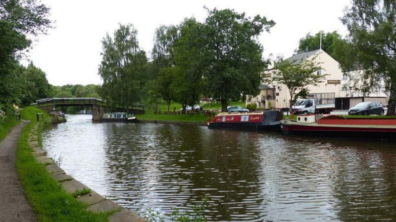 Man and dog found dead after canal boat fire