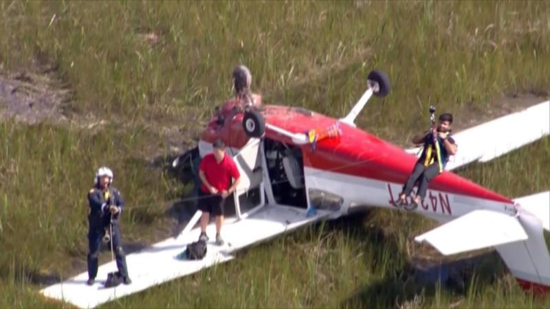 Watch: Two people rescued after plane crashes in Everglades