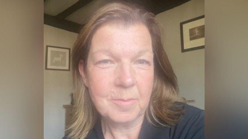 Selfie image of Pat. She has brown hair.