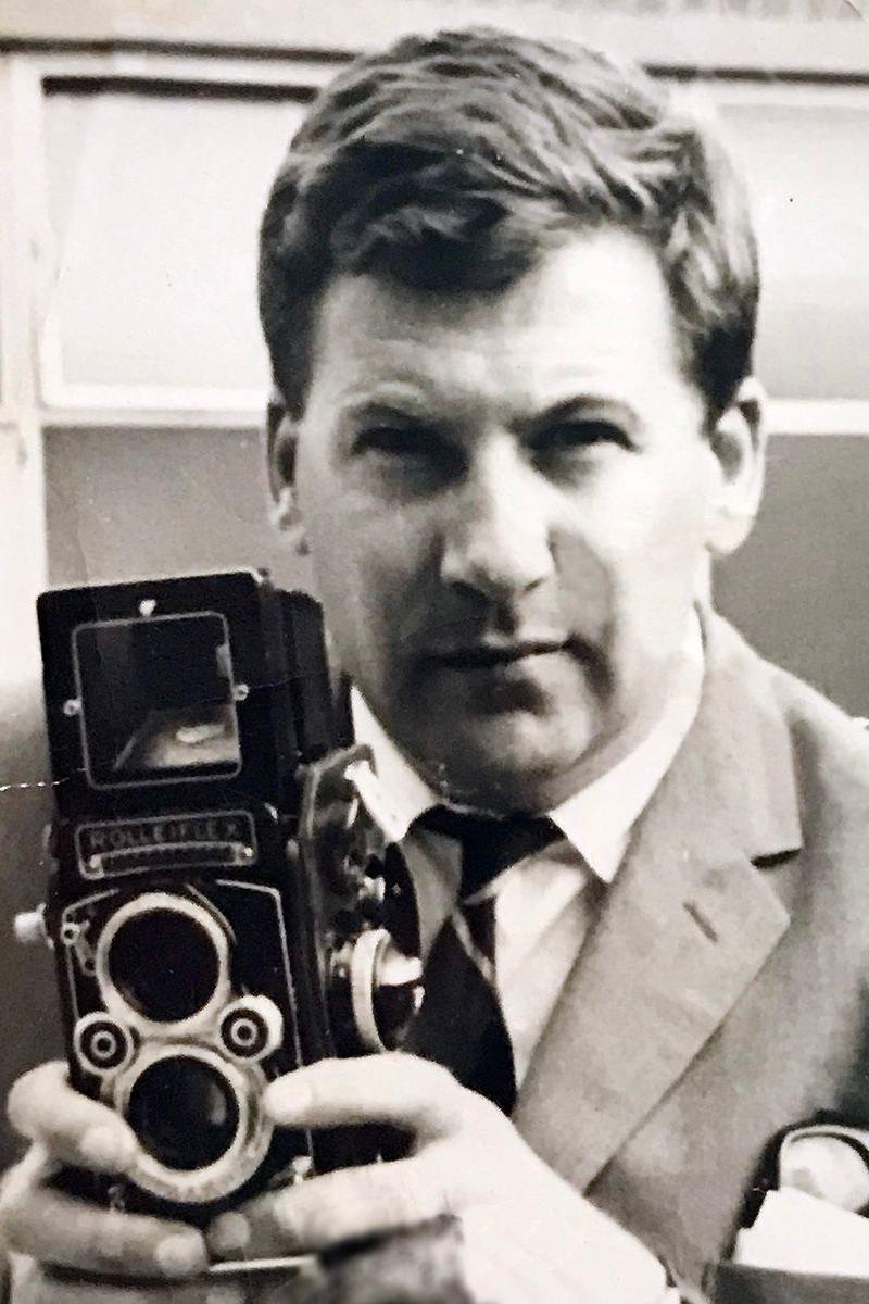 Photographer Peter Price holding a camera