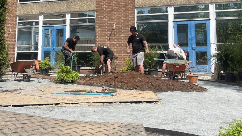 People at work in garden