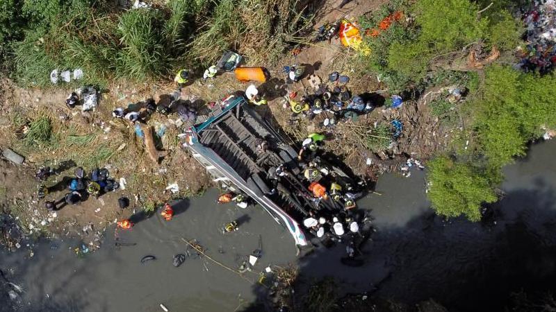 A drone view shows first responders working at the site of a deadly bus crash, in Guatemala City, Guatemala February 10, 2025.