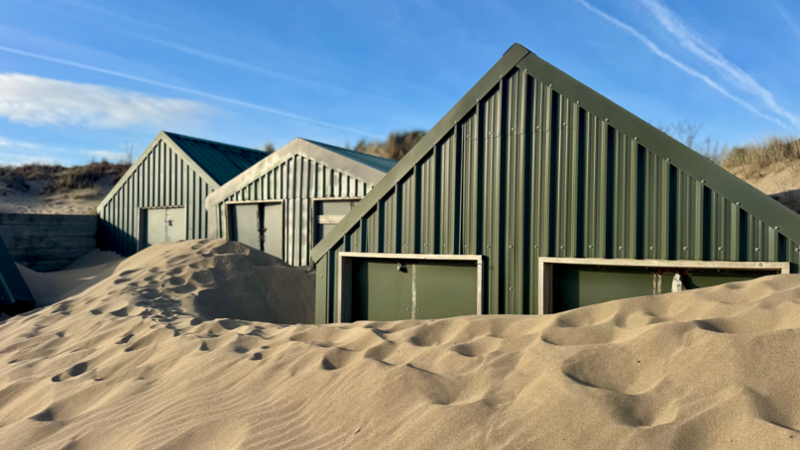 Beach huts worth £250k get buried in sand