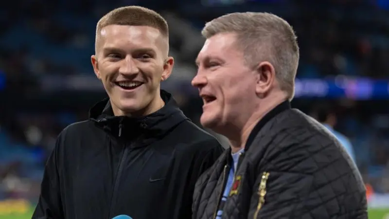 Campbell Hatton stands and laughs alongside his father Ricky Hatton