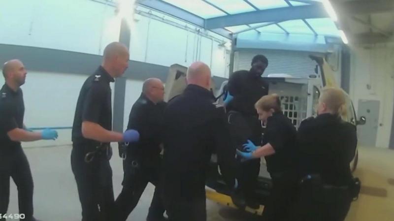 Killer kicked officer at station, inquiry shown