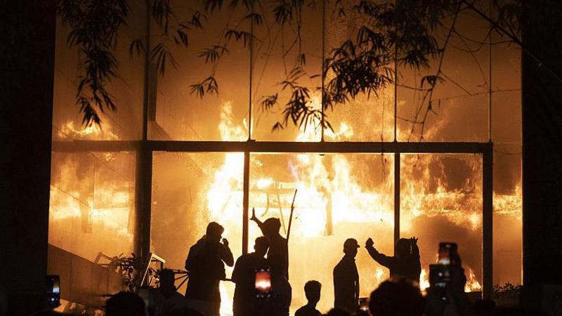 'I can't breathe any more': Inside the night a mob burned a newspaper