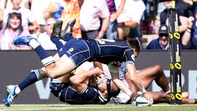 Scotland's Jamie Dobie scores his second try against Fiji