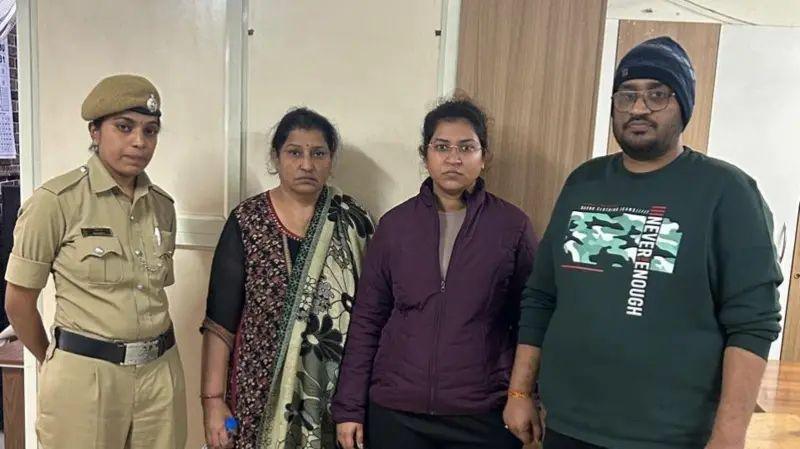 Nikita Singhania (second from right) with her mother and brother after their arrest