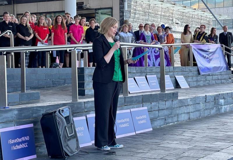 Elizabeth Atherton stands on the Senedd steps making a speech