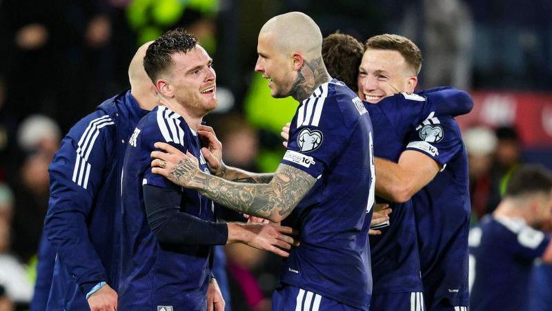 Scotland players celebrate World Cup qualification