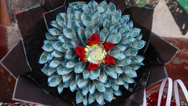 Kenyans drop flowers for Valentine's bouquets of cash. Not everyone is impressed