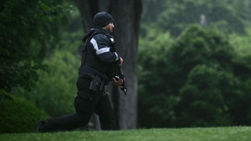Journalists run for cover as they report possible gunfire near White House
