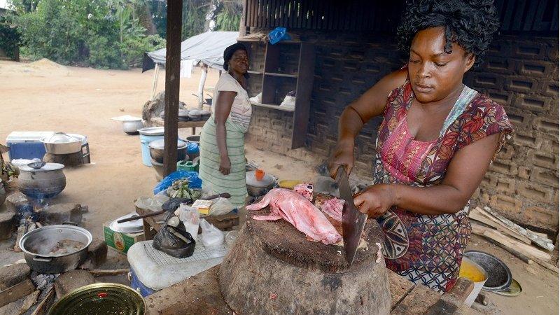 woman preparing meat