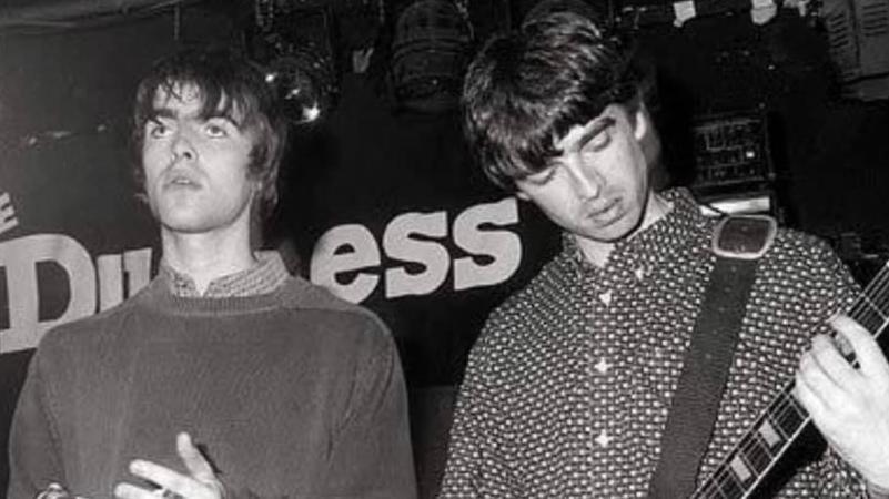 Oasis members Liam and Noel Gallagher playing at The Duchess in Leeds