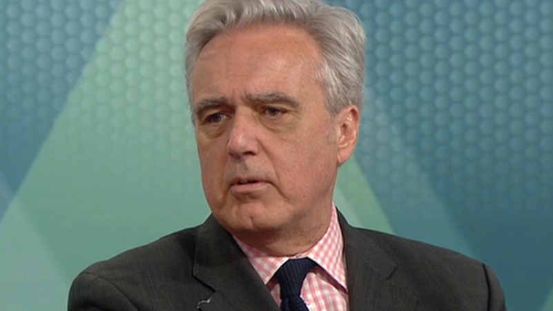 Conservative MP Mark Garnier, a man with grey hair, wearing a pink- and white-check shirt with a blue tie under a dark jacket.